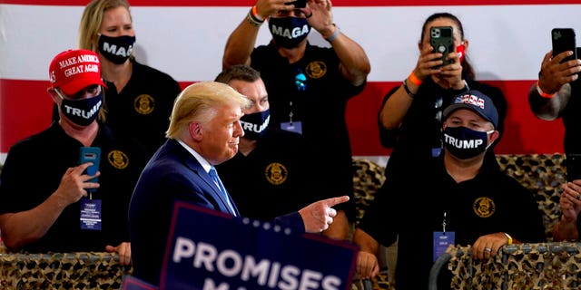President Donald Trump arrives to speak to a crowd of supporters at the Yuma International Airport Tuesday, Aug. 18, 2020, in Yuma, Ariz. (AP Photo/Matt York)