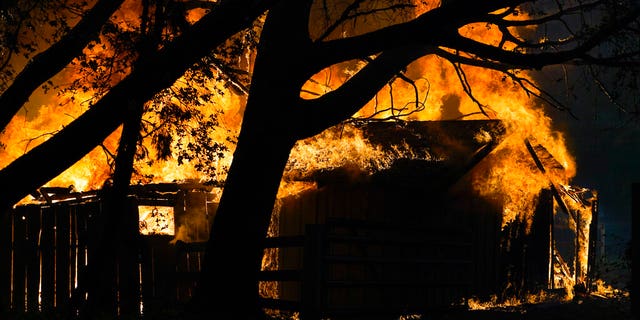 A structure is damaged by the CZU August Lightning Complex Fire in Aug. 20, in Bonny Doon, Calif. (AP Photo/Marcio Jose Sanchez)