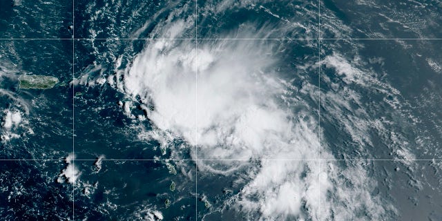 This satellite image released by the National Oceanic and Atmospheric Administration (NOAA) shows Tropical Storm Laura in the North Atlantic Ocean, Friday, Aug. 21, 2020. Laura formed Friday in the eastern Caribbean and forecasters said it poses a potential hurricane threat to Florida and the U.S. Gulf Coast. A second storm also may hit the U.S. after running into Mexico's Yucatan Peninsula. (NOAA via AP)