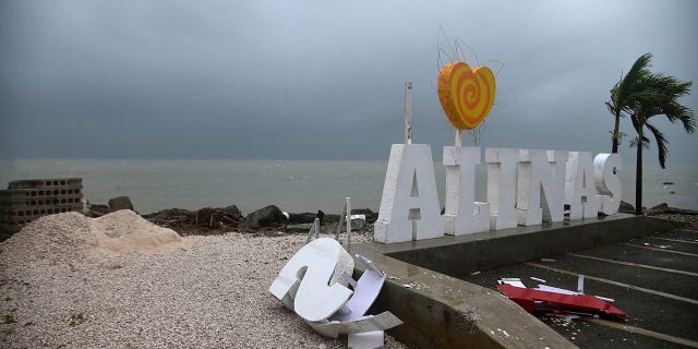 Remnants of a city sign lay on the beach damaged by Tropical Storm Laura in Salinas, Puerto Rico, Saturday, Aug. 22, 2020. (Associated Press)