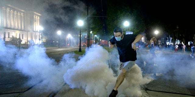 Wisconsin Gov. Tony Evers has summoned the National Guard to head off another round of violent protests after the police shooting of a Black man under murky circumstances turned Kenosha into the nation’s latest flashpoint city in a summer of racial unrest (Sean Krajacic/Kenosha News via AP)