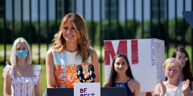 First lady Melania Trump visits an exhibit of artwork by young Americans in celebration of the 100th anniversary of the 19th amendment which afforded the vote to women, at the White House in Washington, Monday, Aug. 24, 2020. (AP Photo/J. Scott Applewhite)