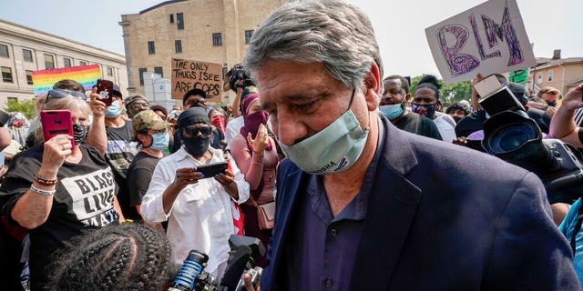 Kenosha Mayor John Antaramian walking away after trying to speak to protesters Monday in his city.
