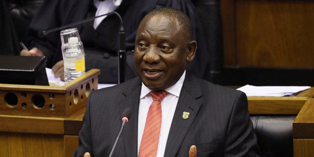 In this Thursday, Feb. 13, 2020 file photo, South African President Cyril Ramaphosa delivers his State of the Nation Address in Cape Town, South Africa. (Sumaya Hisham/Pool Photo via AP, File)