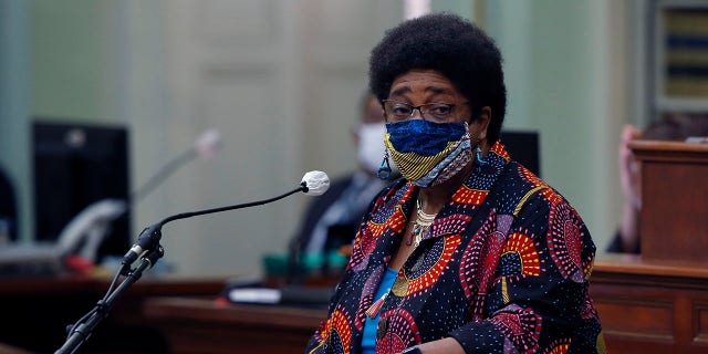 FILE - In this June 11, 2020, file photo, then-Assemblywoman Shirley Weber, D-San Diego, wears a face mask as she calls on lawmakers to create a task force to study and develop reparation proposals for African Americans, during the Assembly session in Sacramento, Calif. (AP Photo/Rich Pedroncelli, File)