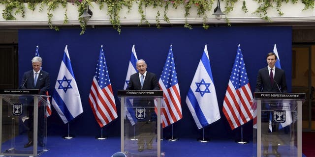 O'Brien, left, Netanyahu, center, and White House adviser Jared Kushner make joint statements to the press about the Israeli-United Arab Emirates peace accords, in Jerusalem, Sunday, Aug. 30, 2020. (Debbie Hill/Pool Photo via AP)