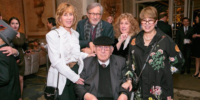 Arnold Spielberg is surrounded by his children, Nancy Spielberg, Steven Spielberg, Anne Spielberg and Sue Spielberg, at the celebration of his 100th birthday in 2017.