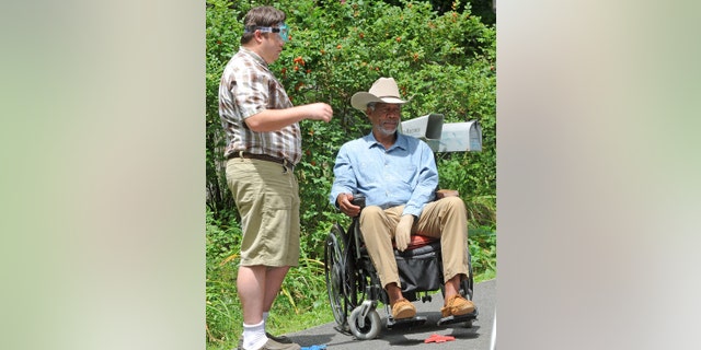 Ash Christian and Morgan Freeman spin on location for "Summer at Dog Dave" on August 4, 2011 in Greenwood Lake, New York.  (Getty Images)