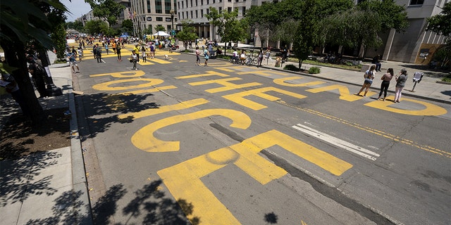 "Defund the Police" is painted on the street in Black Lives Matter Plaza near the White House in Washington, D.C., on Sunday, June 14, 2020. (Stefani Reynolds/Bloomberg via Getty Images)