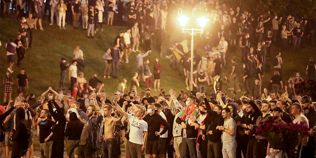 Protesters shout "Go away!" as they gather after the Belarusian presidential election in Minsk, Belarus, Sunday, Aug. 9, 2020. Belarus police and protesters clashed in the capital and the city of Brest Sunday night after a presidential election in which the country's longtime leader sought a sixth term despite rising discontent with his authoritarian rule and his cavalier dismissal of the coronavirus pandemic.