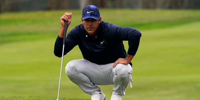 Brooks Koepka lines up a putt on the 13th hole during the third round of the PGA Championship golf tournament at TPC Harding Park, Aug. 8, 2020, in San Francisco. (Associated Press)