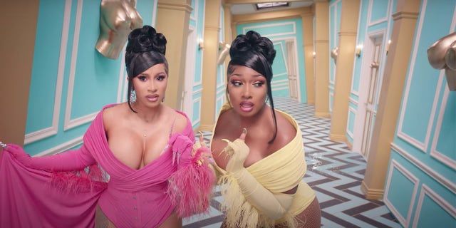 Cardi B (left) and Megan Thee Stallion in the music video for 'WAP.' The song has been criticized for its explicit lyrics.