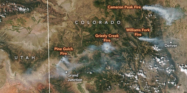 Colorado wildfires burn more than 130,000 acres, smoke spotted ...