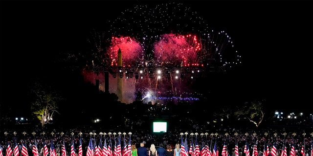 US President Donald Trump (2nd L), First Lady Melania Trump (L) and family members stand to watch fireworks after the president delivered his acceptance speech for the Republican Party nomination for reelection during the final day of the Republican National Convention from the South Lawn of the White House on August 27, 2020 in Washington, DC. (Photo by Doug Mills / POOL / AFP) (Photo by DOUG MILLS/POOL/AFP via Getty Images)