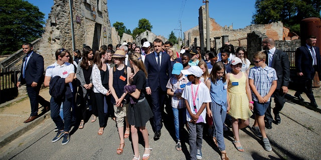 French President Emmanuel Macron attends a visit of the ruins in the French martyr village of Oradour-sur-Glane, France June 10, 2017. (REUTERS/Stephane Mahe/File Photo)