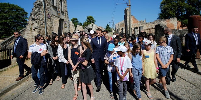 French President Emmanuel Macron attends a visit of the ruins in the French martyr village of Oradour-sur-Glane, France June 10, 2017. (REUTERS/Stephane Mahe/File Photo)