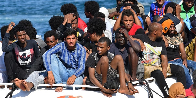 Migrants from Tunisia and Libya arrive on Italian Guardia Costiera (coast guard) boats on Pelage Island, Lampedusa, Italy, on August 1, 2020.