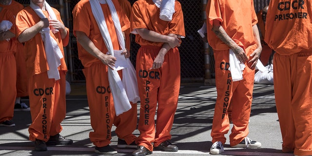 Inmates stand outside at San Quentin State Prison in San Quentin, California, U.S., on Tuesday, Aug. 16, 2016. (Getty Images)