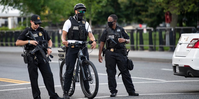 U.S. Secret Service staff respond to a shooting near the White House, Aug. 10, 2020. (Xinhua/Liu Jie via Getty Images)