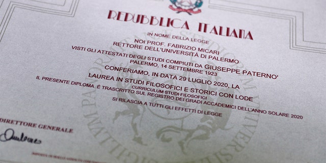 The graduation certificate of Giuseppe Paterno's, 96, Italy's oldest student, who completed his undergraduate degree in history and philosophy, is pictured at the University of Palermo, in Palermo, Italy, July 29, 2020. REUTERS/Guglielmo Mangiapane SEARCH "ITALY'S OLDEST STUDENT" FOR THIS STORY. SEARCH "WIDER IMAGE" FOR ALL STORIES. - RC294I9DDBSK