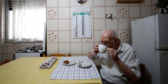 Giuseppe Paterno, 96, Italy's oldest student, has breakfast in his kitchen, two days before he graduates from The University of Palermo with an undergraduate degree in history and philosophy, at his home in Palermo, Italy, July 27, 2020. REUTERS/Guglielmo Mangiapane SEARCH "ITALY'S OLDEST STUDENT" FOR THIS STORY. SEARCH "WIDER IMAGE" FOR ALL STORIES. - RC294I9K9JZI