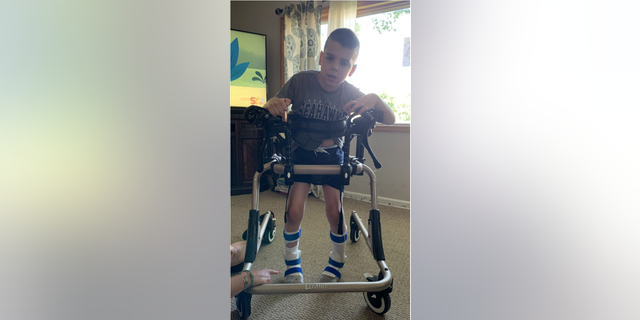 Christopher Heisel, 10, who suffers from cerebral palsy, can no longer bear any weight on his legs after in-person therapies closed amid the pandemic. (Photo courtesy of Kristy Heisel, Jamie Scalise)