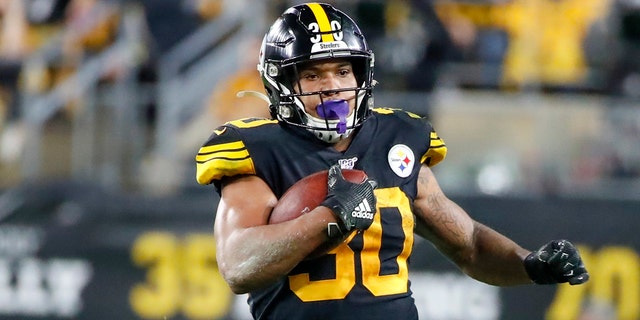 In this Oct. 28, 2019, file photo, Pittsburgh Steelers running back James Conner (30) plays against the Miami Dolphins in an NFL football game in Pittsburgh. Conner wants to prove he can finish a season healthy. (AP Photo/Don Wright, File)