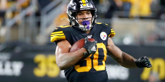 In this Oct. 28, 2019, file photo, Pittsburgh Steelers running back James Conner (30) plays against the Miami Dolphins in an NFL football game in Pittsburgh. Conner wants to prove he can finish a season healthy. (AP Photo/Don Wright, File)