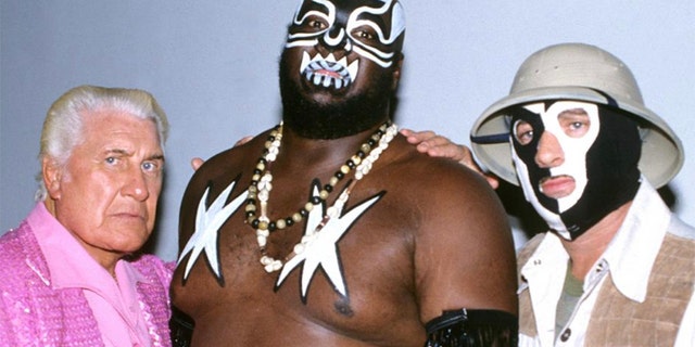 WWE star James 'Kamala' Harris (center) has died at the age of 70. (Courtesy of WWE)
