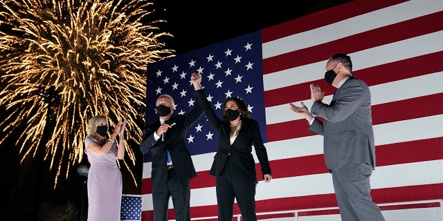 Democratic presidential candidate former Vice President Joe Biden, and his wife Jill Biden, watch fireworks with Democratic vice presidential candidate Sen. Kamala Harris, D-Calif., and her husband Doug Emhoff, during the fourth day of the Democratic National Convention, Thursday, Aug. 20, 2020, at the Chase Center in Wilmington, Del. (AP Photo/Andrew Harnik)