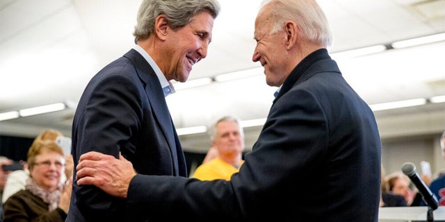 President Joe Biden greets Kerry in Iowa on Feb. 1, 2020.