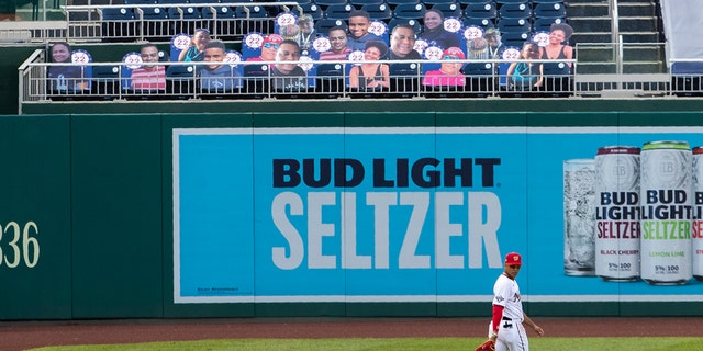 Washington Nationals left fielder Juan Soto walks near cut-outs with number 22 on the bleacher during the first inning of a baseball game against the New York Mets in Washington, Wednesday, Aug. 5, 2020. (AP Photo/Manuel Balce Ceneta)