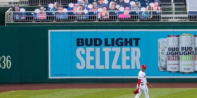 Washington Nationals left fielder Juan Soto walks near cut-outs with number 22 on the bleacher during the first inning of a baseball game against the New York Mets in Washington, Wednesday, Aug. 5, 2020. (AP Photo/Manuel Balce Ceneta)