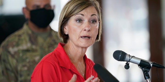 Iowa Gov. Kim Reynolds speaks during a news conference, Friday, Aug. 14, 2020, in Cedar Rapids, Iowa. The storm that struck Monday morning left tens of thousands of residents of Iowans without power as of Friday morning. (AP Photo/Charlie Neibergall)