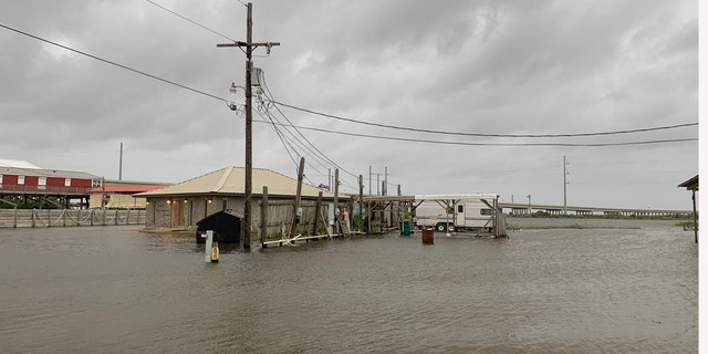 Rising waters as storm surge from Hurricane Laura nears the Gulf Coast can be seen on Wednesday, Aug. 26, 2020.