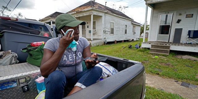 Linda Smoot, who evacuated from Hurricane Laura in a pickup truck with eight others, reacts as they return to see the damaged home of her niece for the first time, in Lake Charles, La., in the aftermath of the hurricane, Sunday, Aug. 30, 2020.