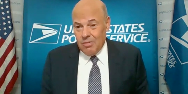 Postmaster General Louis DeJoy testifies in a Senate hearing Friday amid controversy over whether USPS will be able to deliver mail-in ballots on time for the Nov. 3 election. DeJoy assured committee members that he is committed to making that happen and that USPS has the resources to do so.