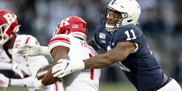 FILE - In this Nov. 30, 2019, file photo, Penn State linebacker Micah Parsons (11) tackles Rutgers tight end Johnathan Lewis (11) in the first quarter of an NCAA college football game, in State College, Pa. (AP Photo/Barry Reeger, File)