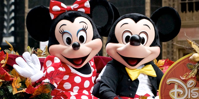 Minnie and Mickey Mouse ride Disney Parks float