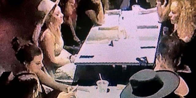 The co-owner of a Nashville restaurant claims that a bachelorette party group, pictured, behaved badly and defied health orders in the establishment.