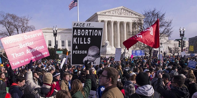 Pro-life advocates march past the U.S. Supreme Court during the 46th annual March for Life in Washington, D.C., U.S., on Jan. 18, 2019. People nationwide gathered in Washington, D.C., for the annual rally against abortion, which that year included a video message from then-President Donald J. Trump and an address by then-Vice President Mike Pence. Photographer: Zach Gibson/Bloomberg via Getty Images