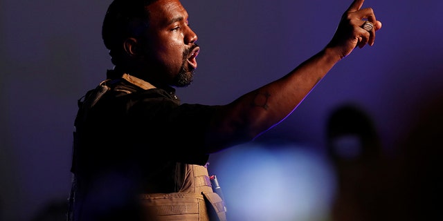 Rapper Kanye West gestures to the crowd as he holds his first rally in support of his presidential bid in North Charleston, S.C., U.S. July 19. REUTERS/Randall Hill