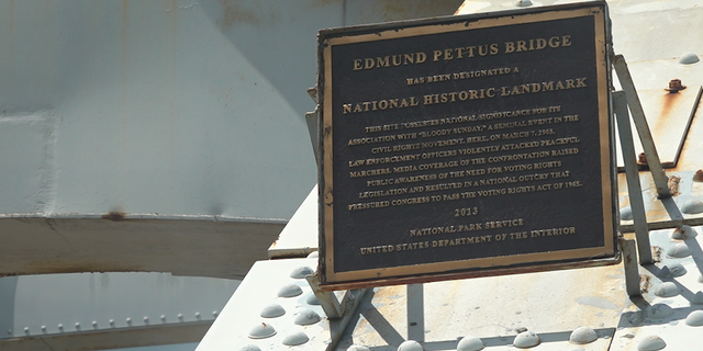 A plaque mounted on the Edmund Pettus Bridge.