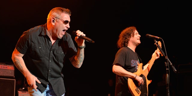 Singer Steve Harwell and bassist Paul de Lisle of Smash Mouth perform during the Under The Sun Tour at The Greek Theatre on August 12, 2014 in Los Angeles, California. (Photo by Michael Tullberg/Getty Images)