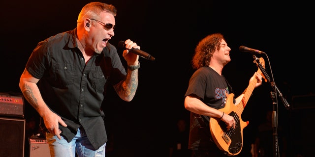 Singer Steve Harwell and bassist Paul de Lisle of Smash Mouth perform during the Under The Sun Tour at The Greek Theatre on August 12, 2014 in Los Angeles, California. (Photo by Michael Tullberg/Getty Images)