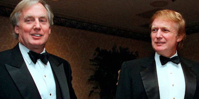 FILE - In this Nov. 3, 1999, file photo, Robert Trump, left, joins then real estate developer and presidential hopeful Donald Trump at an event in New York. (AP Photo/Diane Bonadreff, File)