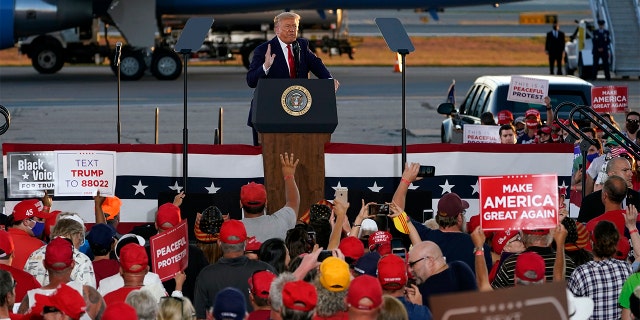 President Donald Trump speaks during a campaign rally at Manchester-Boston Regional Airport, Aug. 28, in Londonderry, N.H. (AP Photo/Charles Krupa)