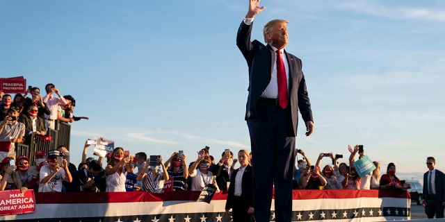 President Donald Trump arrives to speak to a campaign rally, Aug. 28, in Londonderry, N.H. (AP Photo/Evan Vucci)