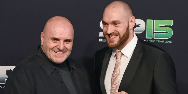 Boxer Tyson Fury and his father, John, arrive to BBC Sports Personality of the Year 2015 at the Titanic Belfast, Titanic Quarter, Olympic Way, Belfast, Co Antrim. Picture credit: Stephen McCarthy / SPORTSFILE 