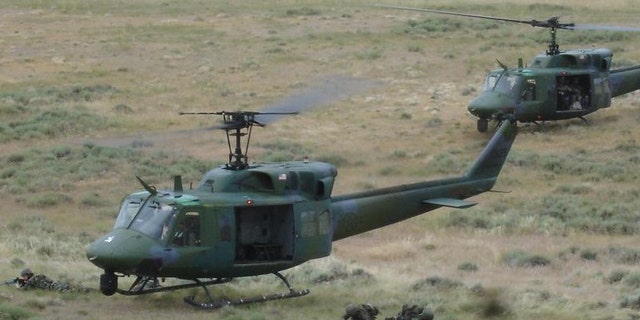 A UH-1N helicopter, seen here in a file image, made an emergency landing after it was struck by a bullet Monday.